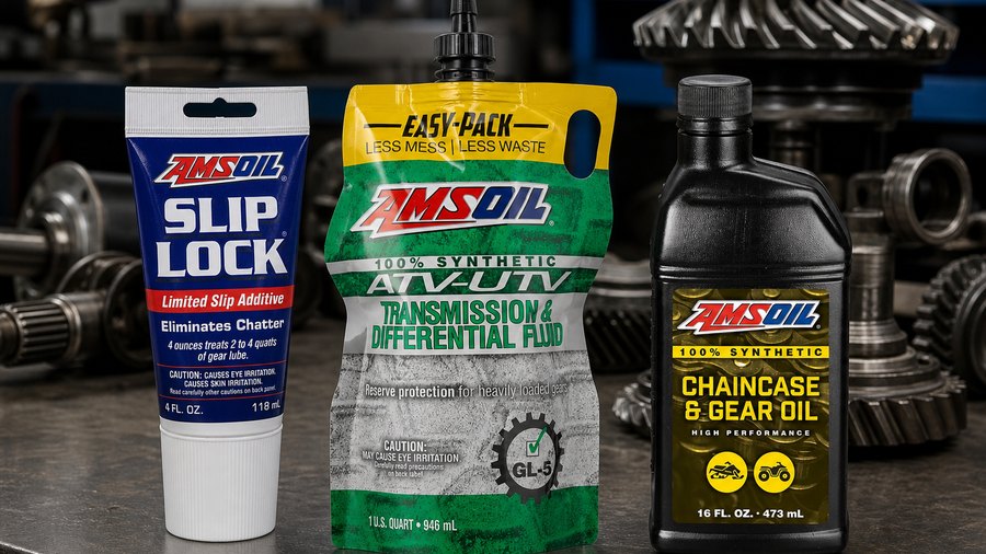 AMSOIL gear lubricant tube, Easy-Pack, and bottle in a drivetrain workshop