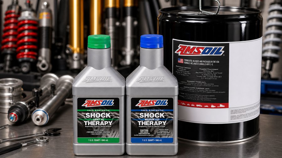 AMSOIL Shock Therapy suspension fluid bottles and pail in a suspension workshop