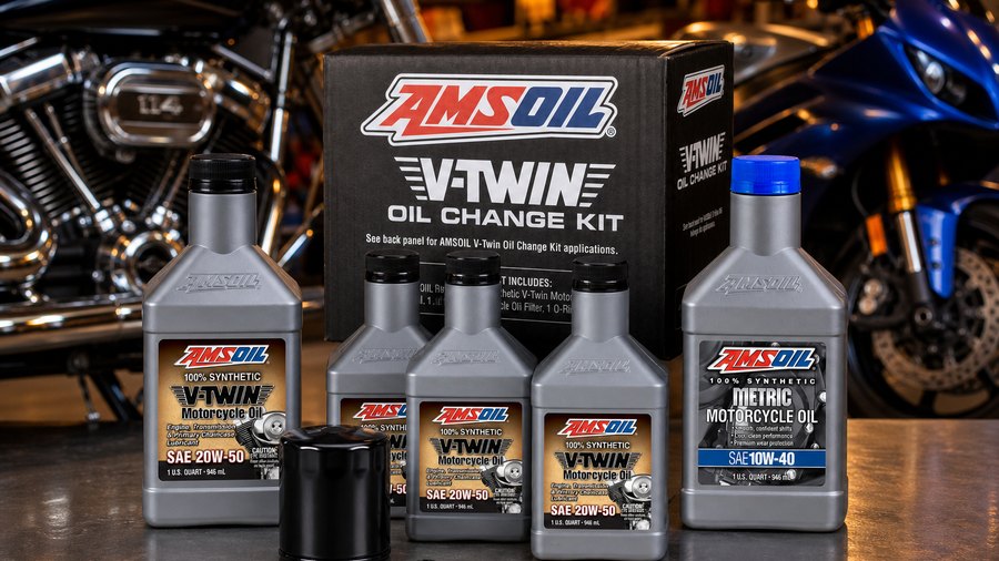 AMSOIL V-Twin oil, Metric motorcycle oil, and V-Twin oil change kit in a motorcycle garage