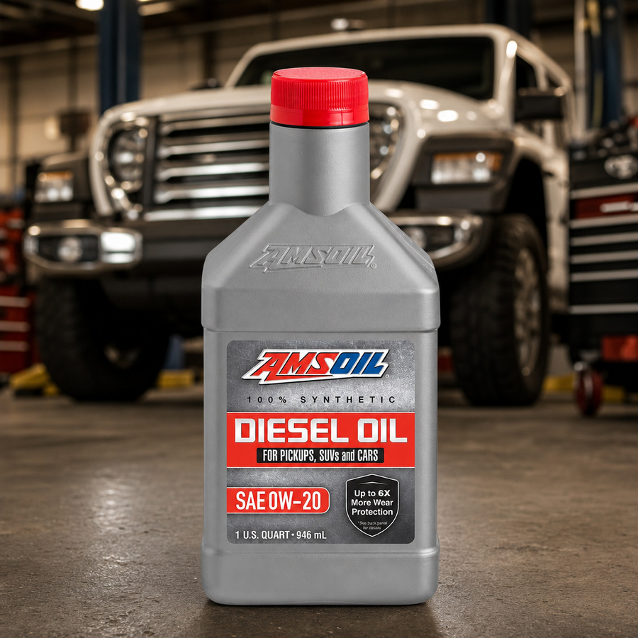 AMSOIL 0W-20 100% Synthetic Diesel Oil staged in a diesel truck shop