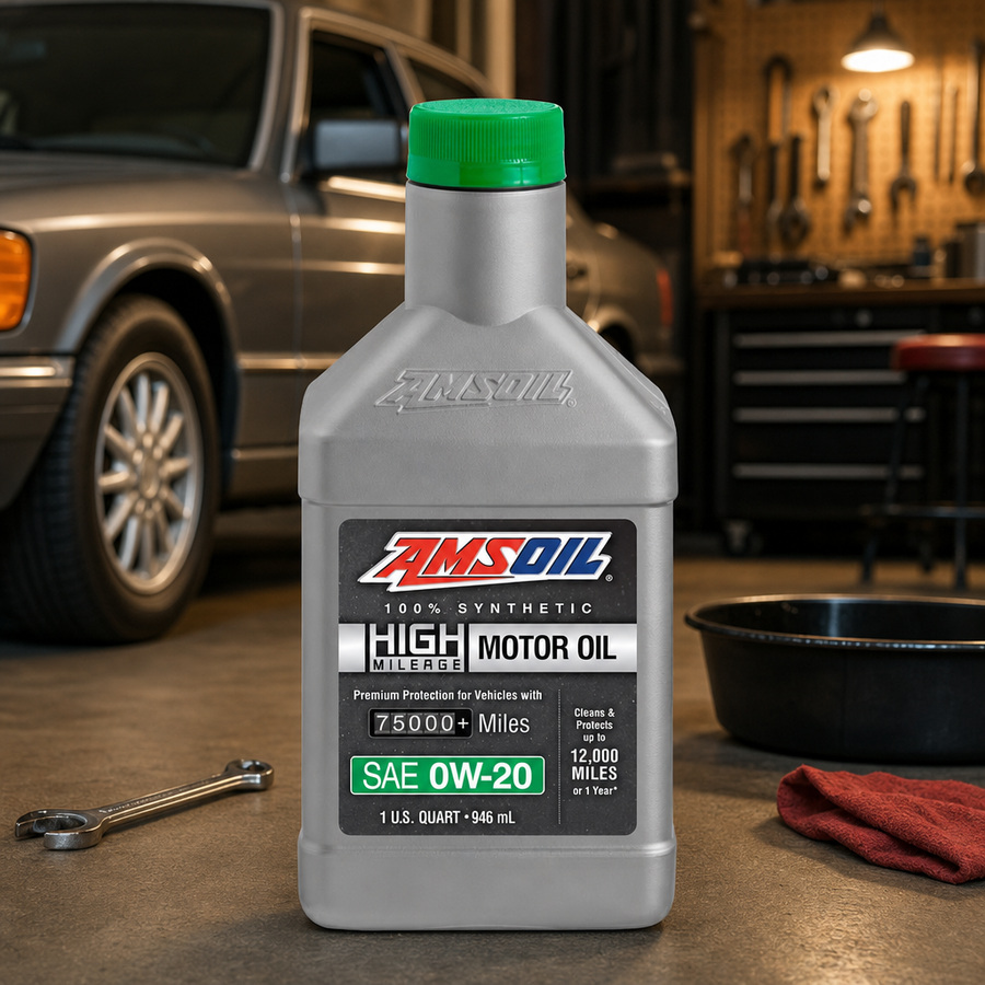 AMSOIL 0W-20 100% Synthetic High-Mileage Motor Oil staged in an automotive service garage