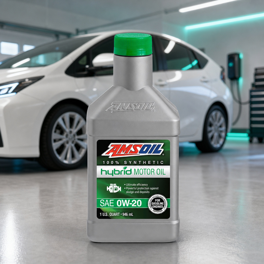 AMSOIL 0W-20 100% Synthetic Hybrid Motor Oil staged in a modern hybrid vehicle service bay