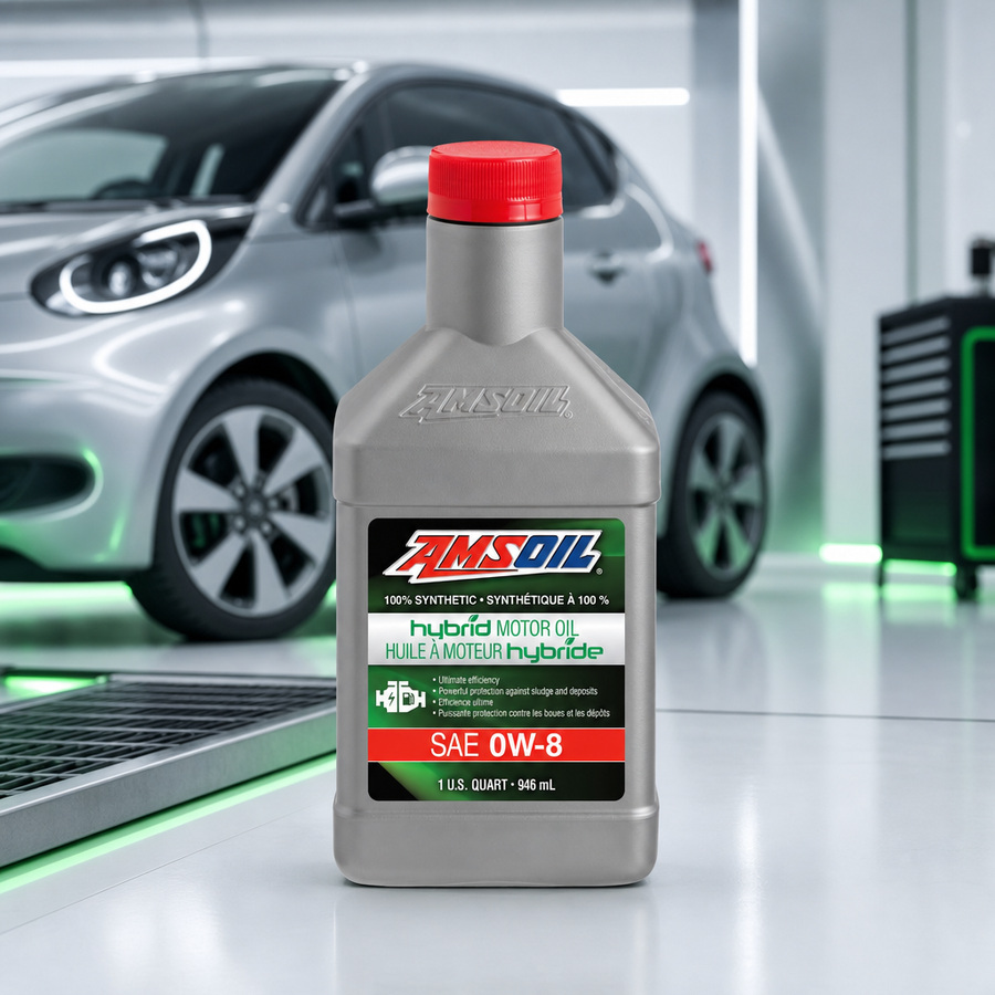 AMSOIL 0W-8 100% Synthetic Hybrid Motor Oil staged in a modern hybrid vehicle service bay