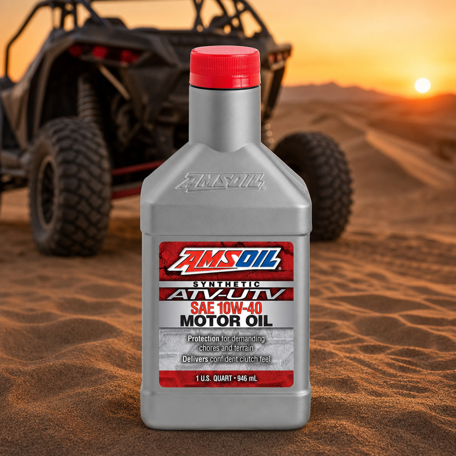 AMSOIL 10W-40 100% Synthetic ATV/UTV Motor Oil staged in a powersports service garage