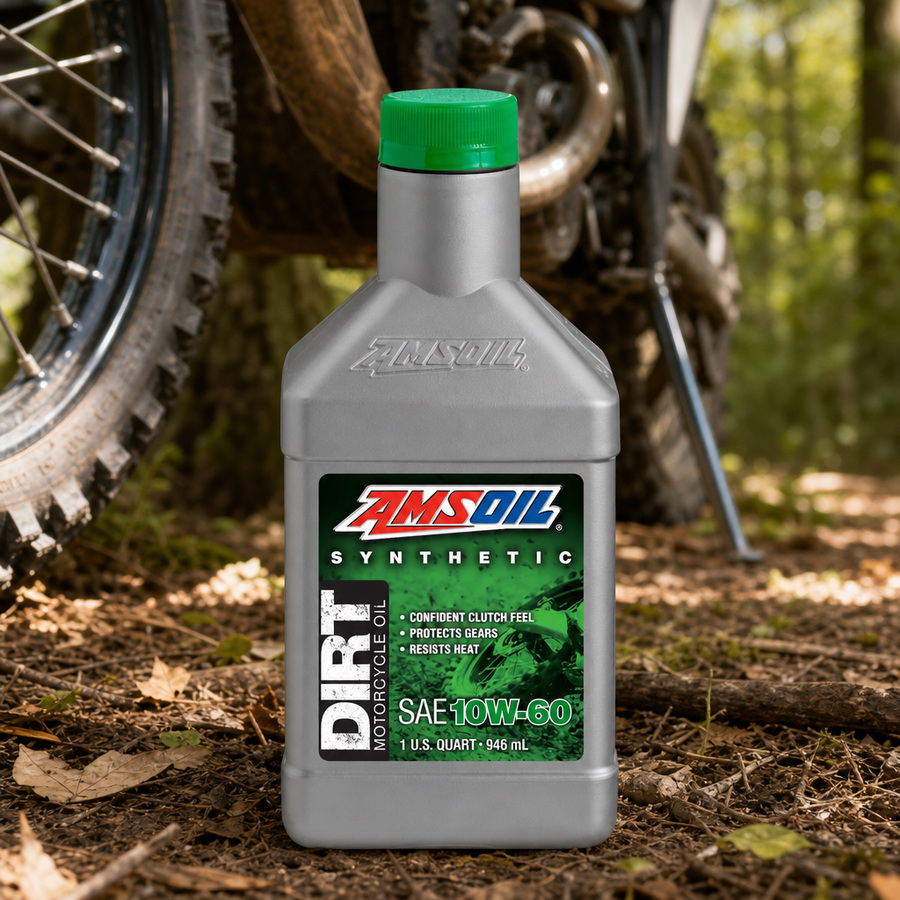 AMSOIL 10W-60 100% Synthetic Dirt Bike Oil staged in a motocross pit area