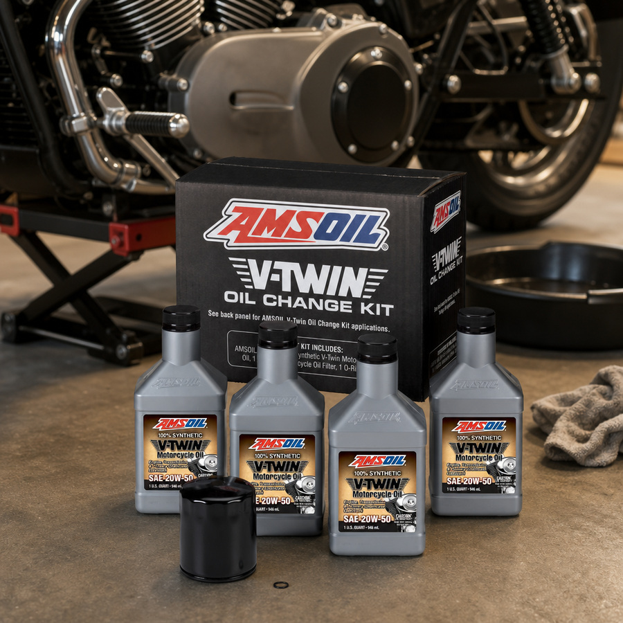 AMSOIL 20W-50 Synthetic V-Twin Oil Change Kit - 4 Quarts with Black Filter staged in a motorcycle workshop