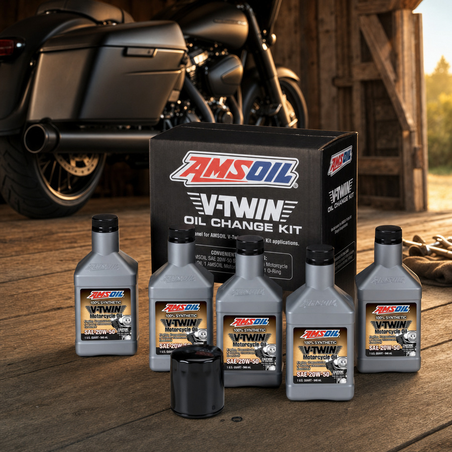 AMSOIL 20W-50 Synthetic V-Twin Oil Change Kit - 5 Quarts with Black Filter staged in a motorcycle workshop