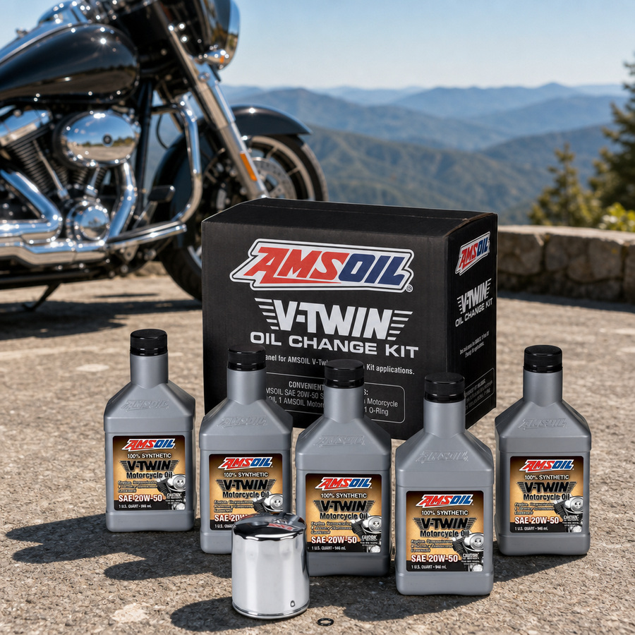 AMSOIL 20W-50 Synthetic V-Twin Oil Change Kit - 5 Quarts with Chrome Filter staged in a motorcycle workshop