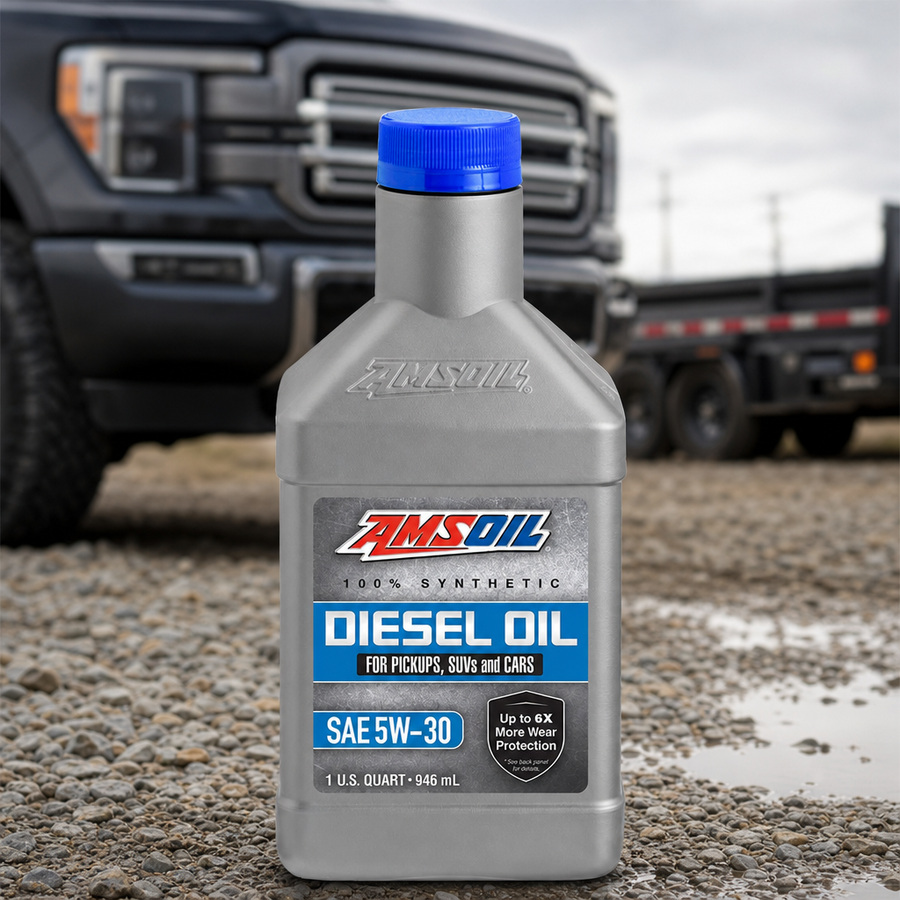 AMSOIL 5W-30 100% Synthetic Diesel Oil staged in a diesel truck shop