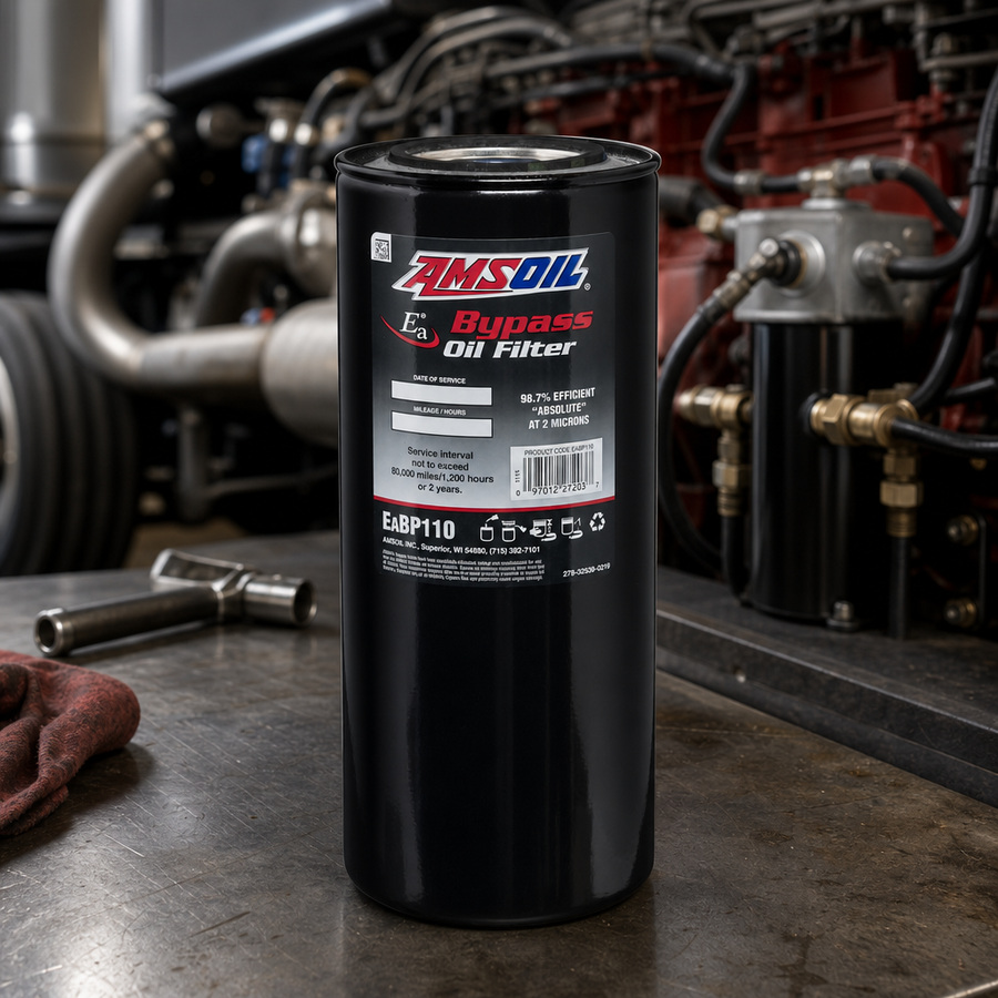 AMSOIL Bypass Oil Filter staged in a truck maintenance garage