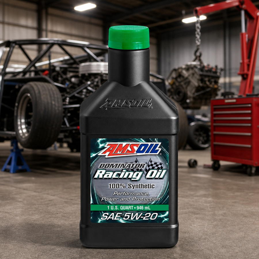 AMSOIL DOMINATOR 5W-20 100% Synthetic Racing Oil staged in a performance race shop