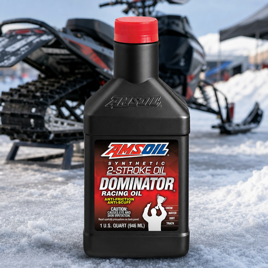 AMSOIL DOMINATOR 100% Synthetic 2-Stroke Racing Oil staged in a performance race shop