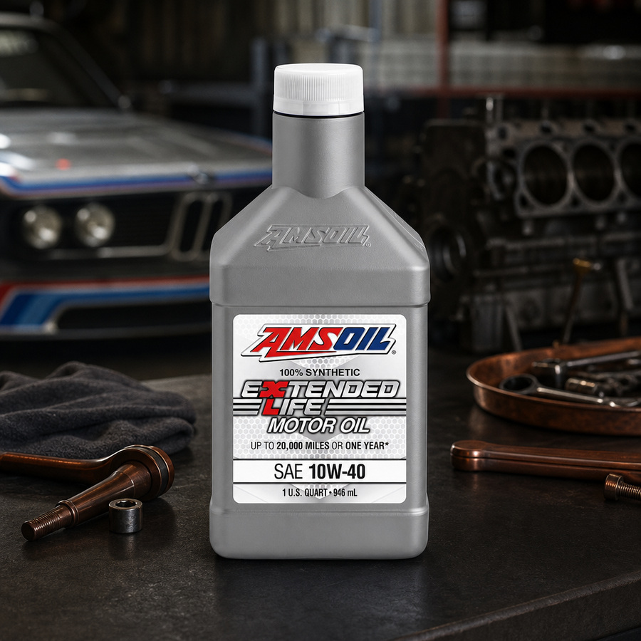 AMSOIL Extended-Life 10W-40 100% Synthetic Motor Oil staged in an automotive service garage