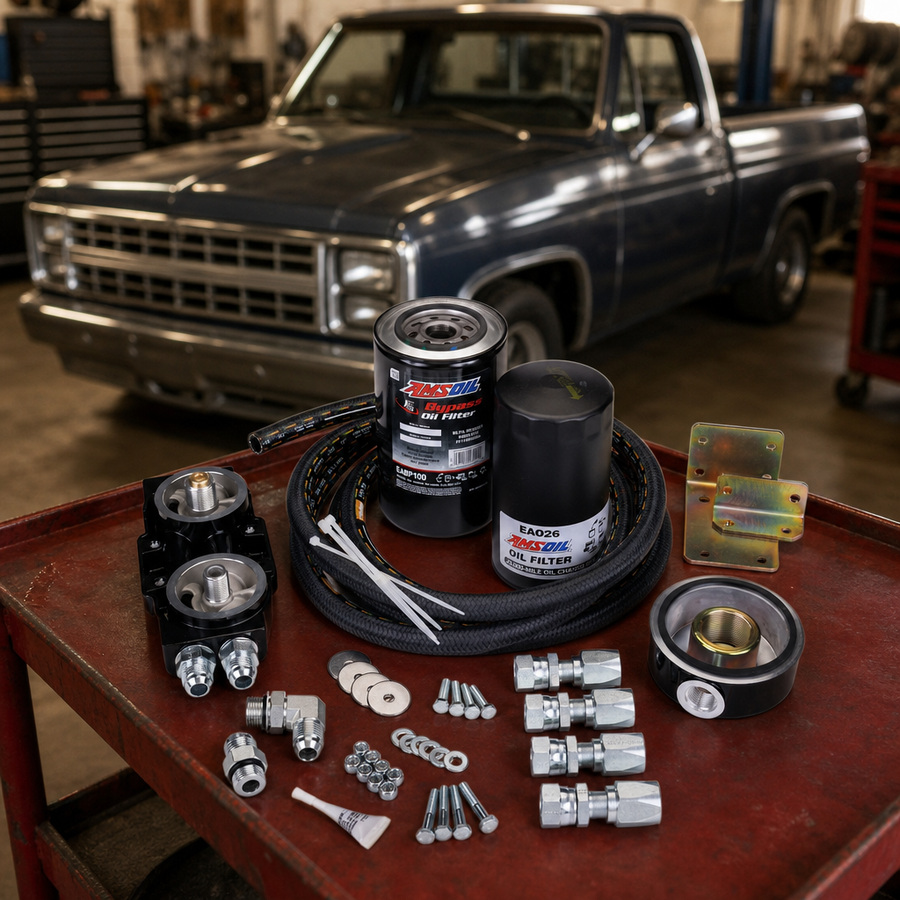 AMSOIL Ford 7.3L Dual-Remote Bypass System staged in a truck maintenance garage