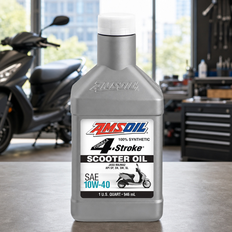 AMSOIL Formula 4-Stroke 100% Synthetic Scooter Oil staged in an outdoor power equipment shop