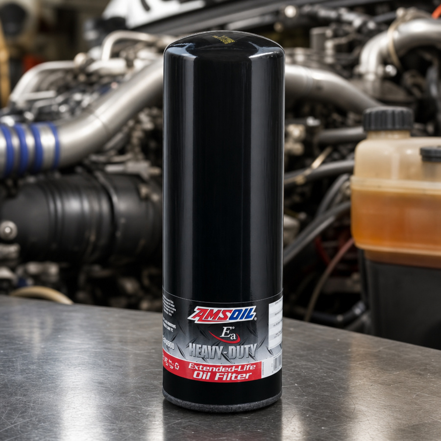 AMSOIL Heavy-Duty Oil Filter staged in an automotive parts workbench