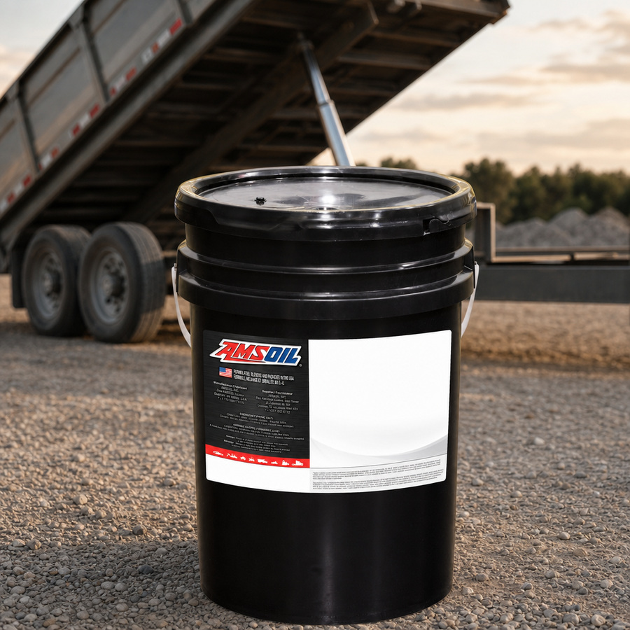 AMSOIL ISO 32 100% Synthetic Multi-Viscosity Hydraulic Oil staged in an industrial equipment maintenance floor