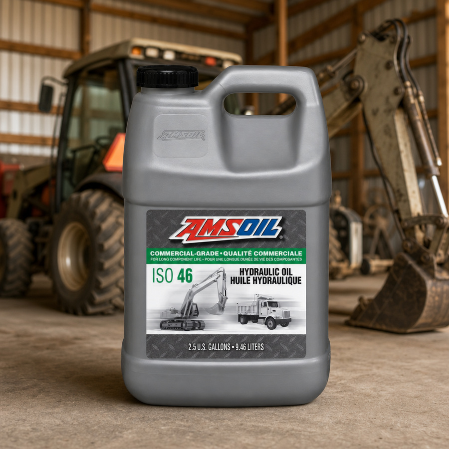 AMSOIL ISO 46 Commercial-Grade Hydraulic Oil staged in an industrial equipment maintenance floor
