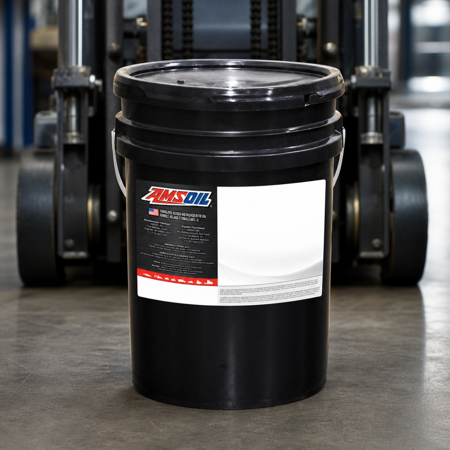AMSOIL ISO 46 100% Synthetic Anti-Wear Hydraulic Oil staged in an industrial equipment maintenance floor