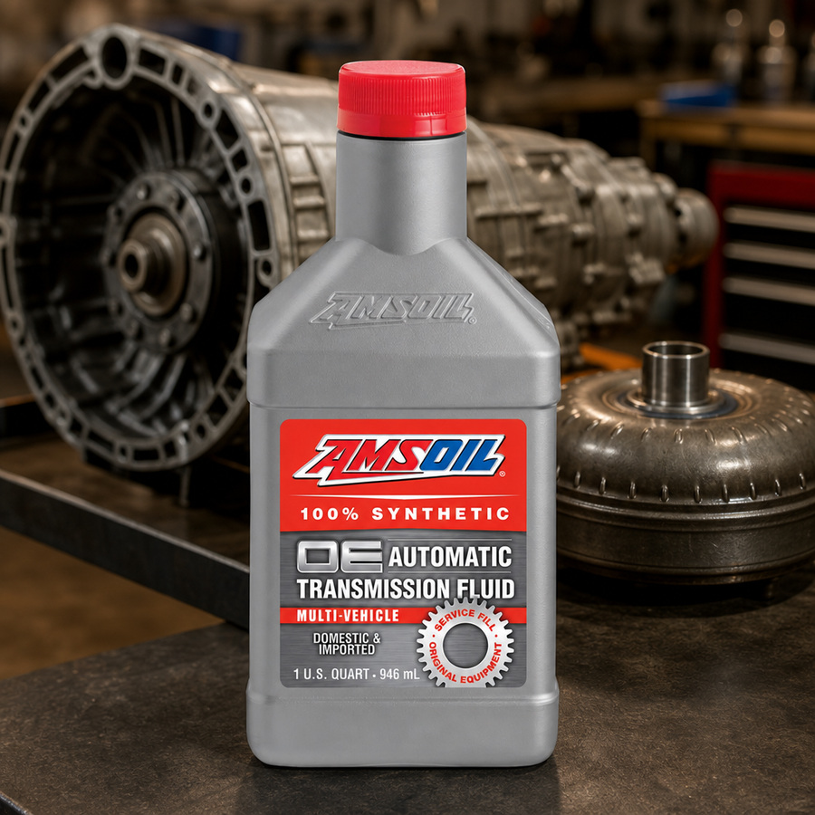AMSOIL OE Multi-Vehicle 100% Synthetic Automatic Transmission Fluid staged in a transmission service bay