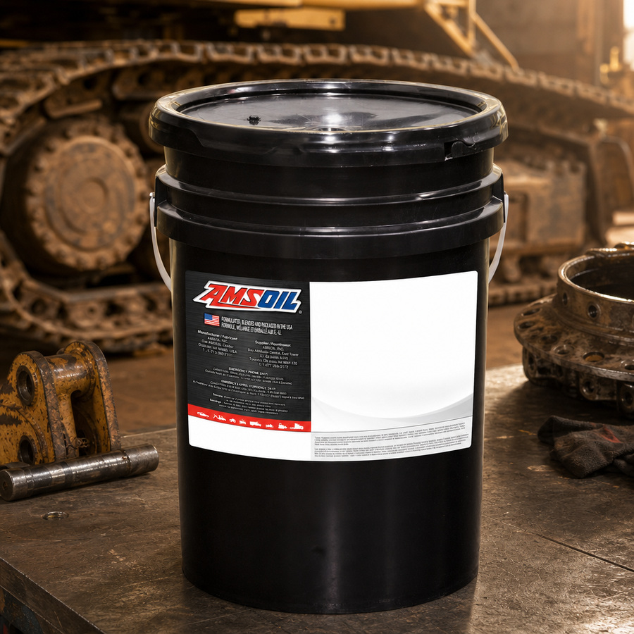 AMSOIL SAE 30 100% Synthetic Powershift Transmission Fluid staged in a transmission service bay