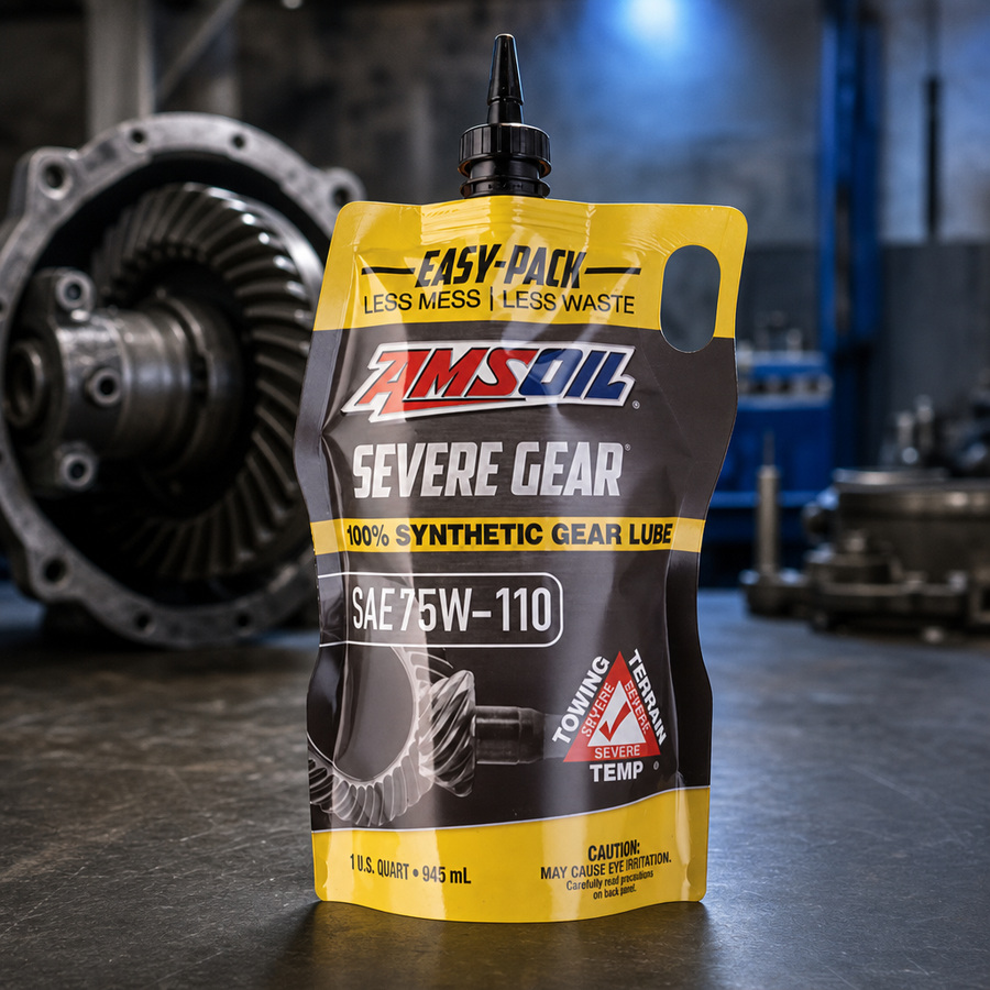 AMSOIL SEVERE GEAR 75W-110 100% Synthetic Gear Lube staged in a drivetrain and gear workshop