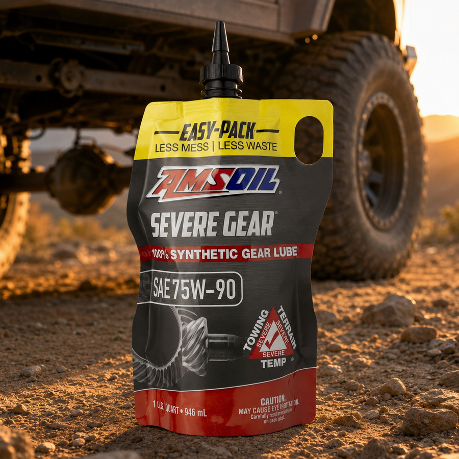 AMSOIL SEVERE GEAR 75W-90 100% Synthetic Gear Lube staged in a drivetrain and gear workshop