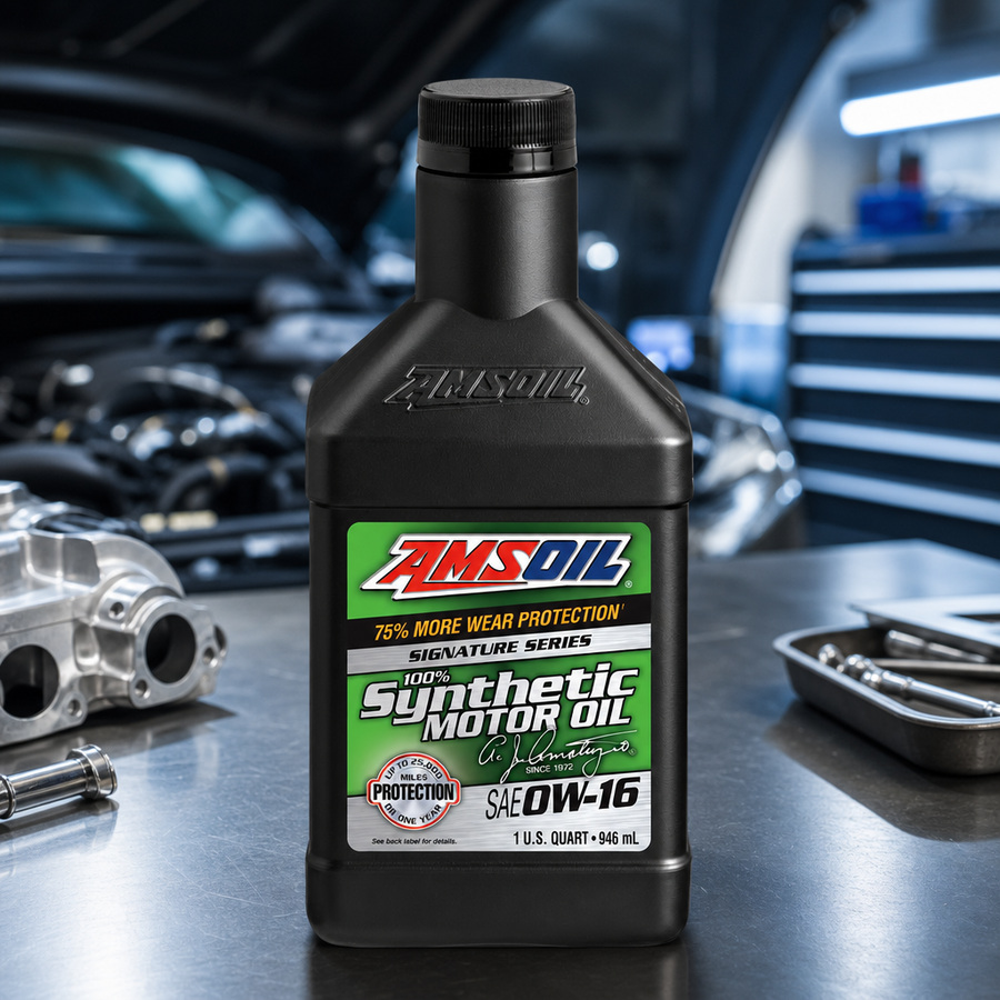 AMSOIL Signature Series 0W-16 100% Synthetic Motor Oil staged in an automotive service garage