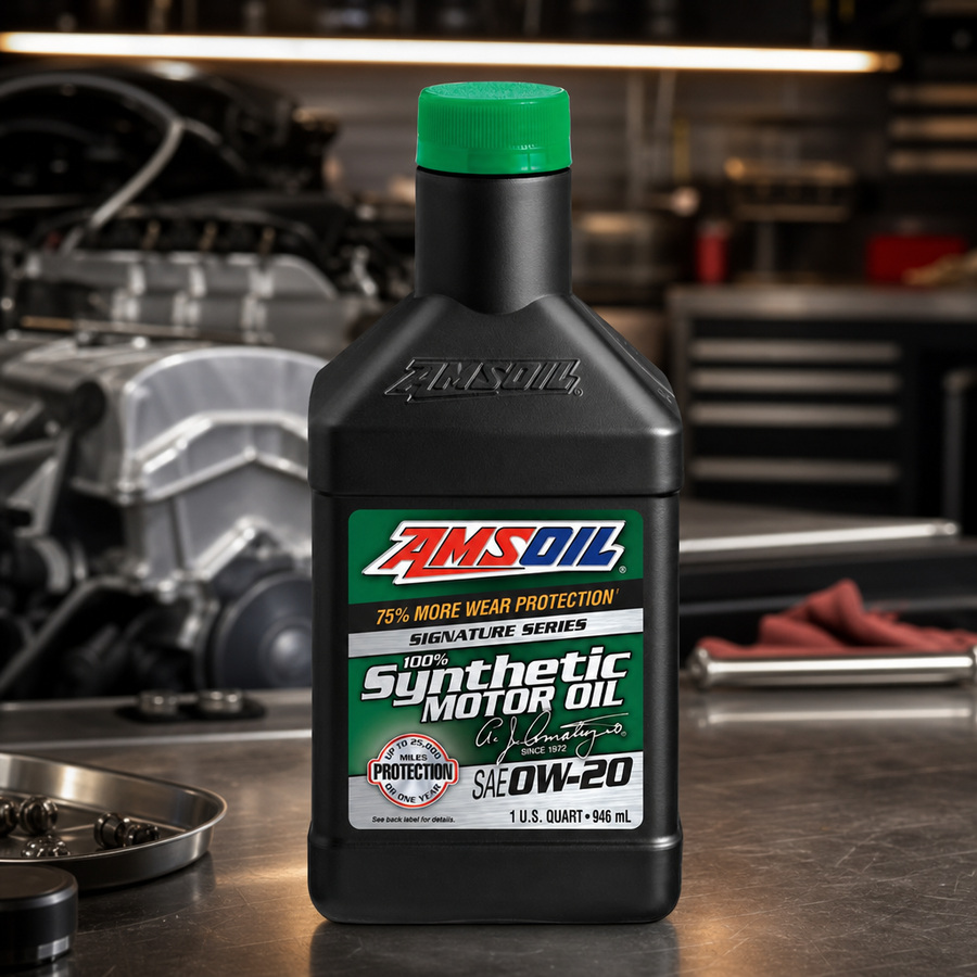 AMSOIL Signature Series 0W-20 100% Synthetic Motor Oil staged in an automotive service garage