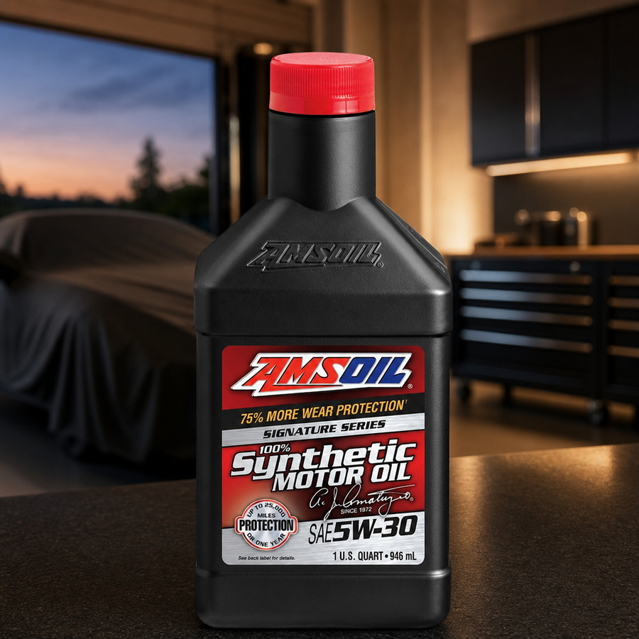 AMSOIL Signature Series 5W-30 100% Synthetic Motor Oil staged in an automotive service garage