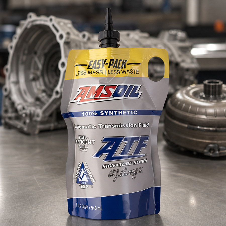 AMSOIL Signature Series Fuel-Efficient 100% Synthetic Automatic Transmission Fluid staged in a transmission service bay