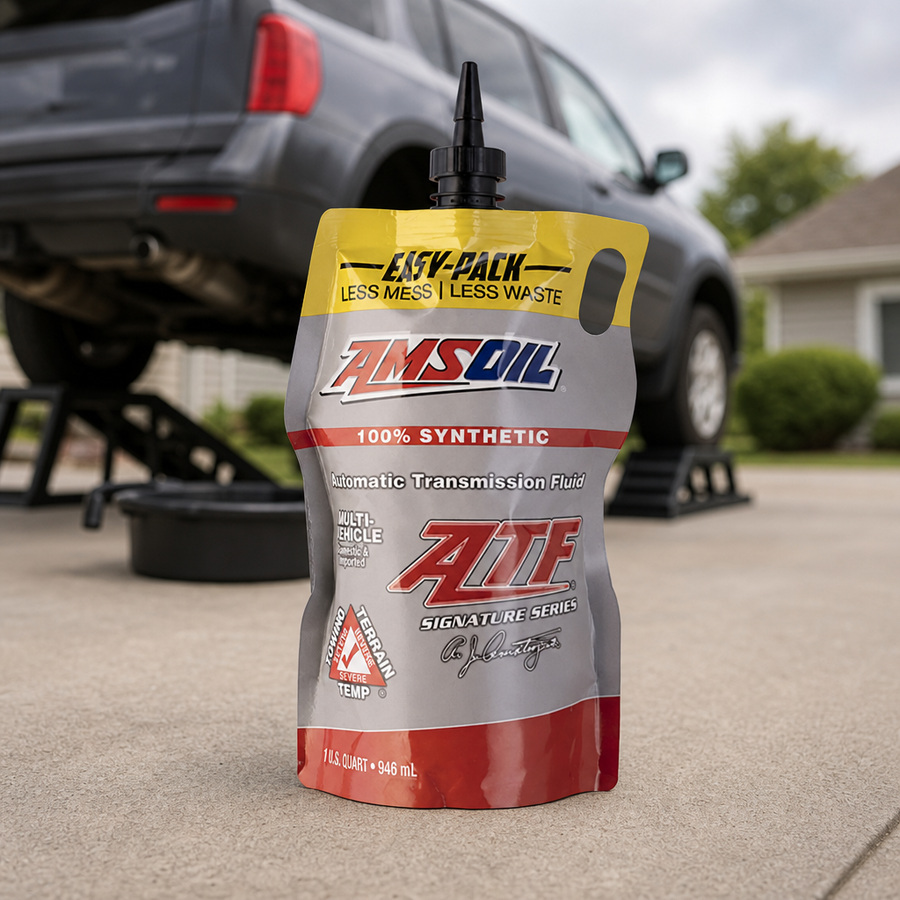 AMSOIL Signature Series Multi-Vehicle 100% Synthetic Automatic Transmission Fluid staged in a transmission service bay