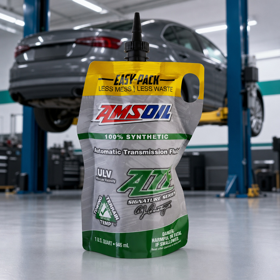 AMSOIL Signature Series ULV 100% Synthetic Automatic Transmission Fluid staged in a transmission service bay