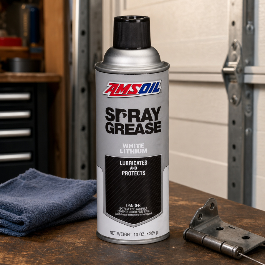 AMSOIL Spray Grease staged in an equipment maintenance shop