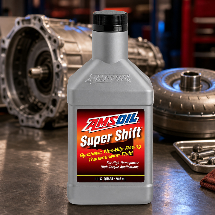 AMSOIL Super Shift Racing Transmission Fluid staged in a performance race shop
