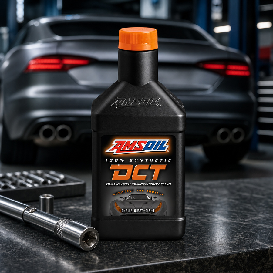 AMSOIL 100% Synthetic DCT Fluid staged in an automotive workshop