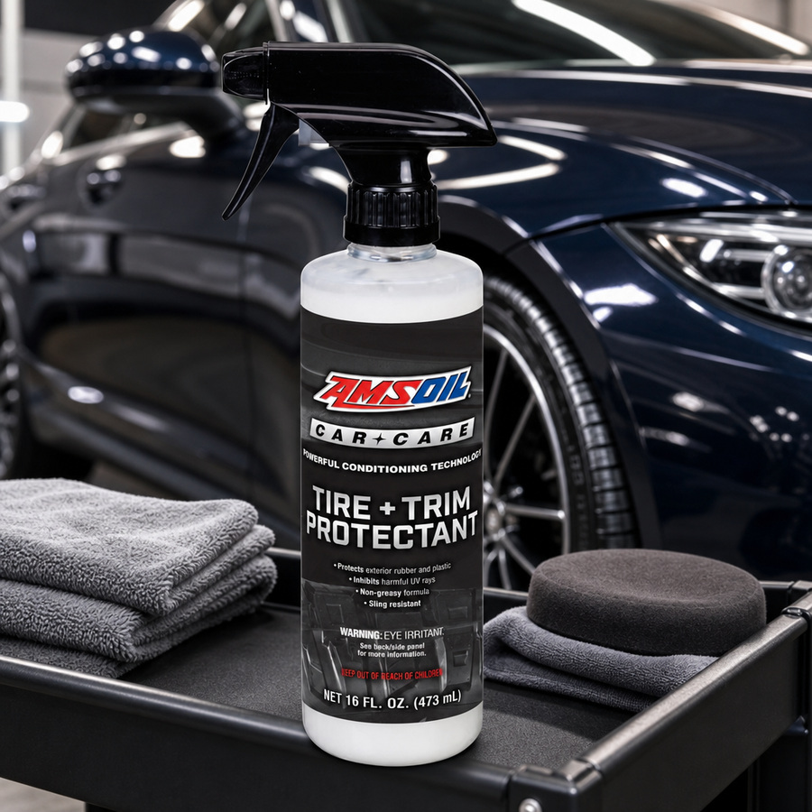 AMSOIL Tire + Trim Protectant staged in a car detailing bay