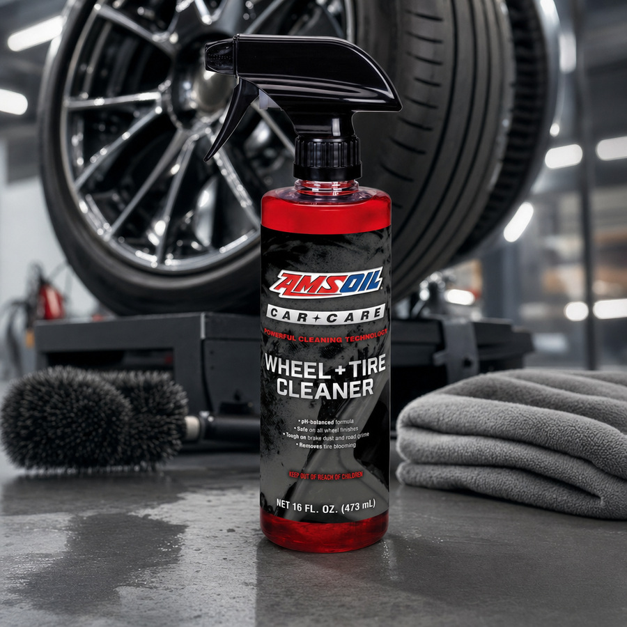 AMSOIL Wheel + Tire Cleaner staged in a car detailing bay